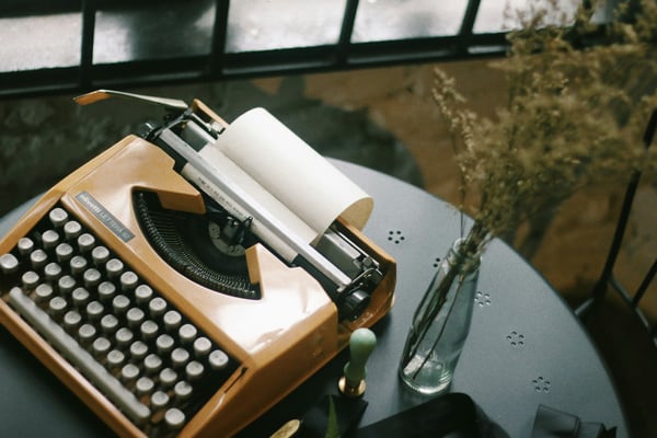 orange-typewriter-on-table