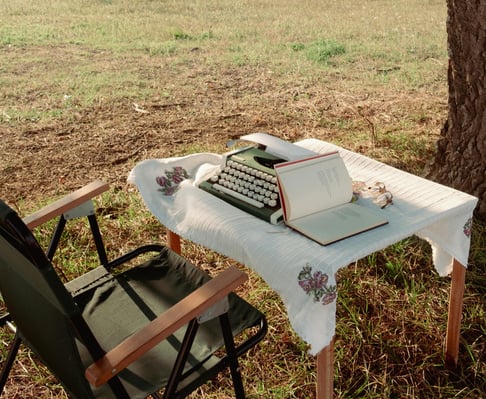 typewriter-and-desk-under-tree